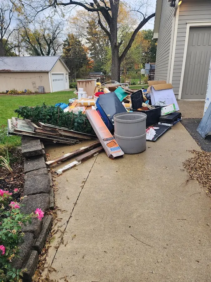 Dumpster being loaded with debris for 3 Yard Dumpster Rental in West Boylston